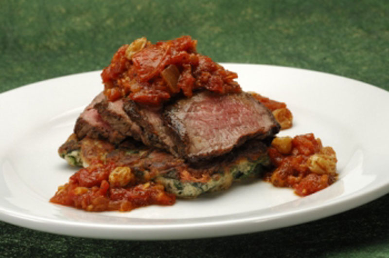 Grilled Flank Steak, with spinach and mushroom pancake served with oven-dried chutney