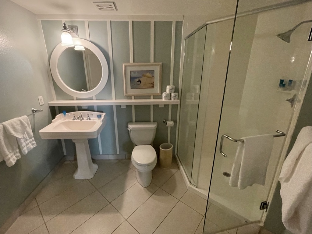 Split bathroom with sink, toilet and shower