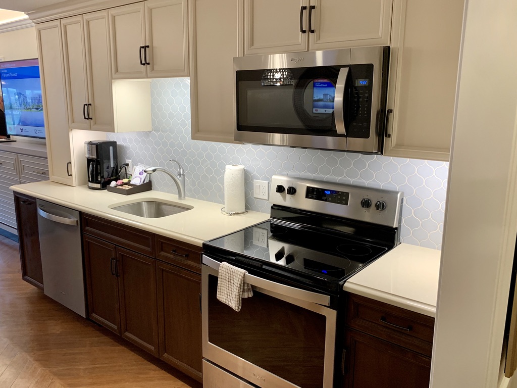 Kitchen cabinets, range, microwave, sink and dishwasher