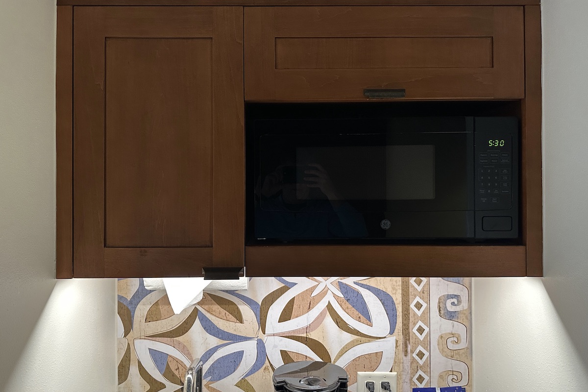 Kitchenette upper cabinet including microwave