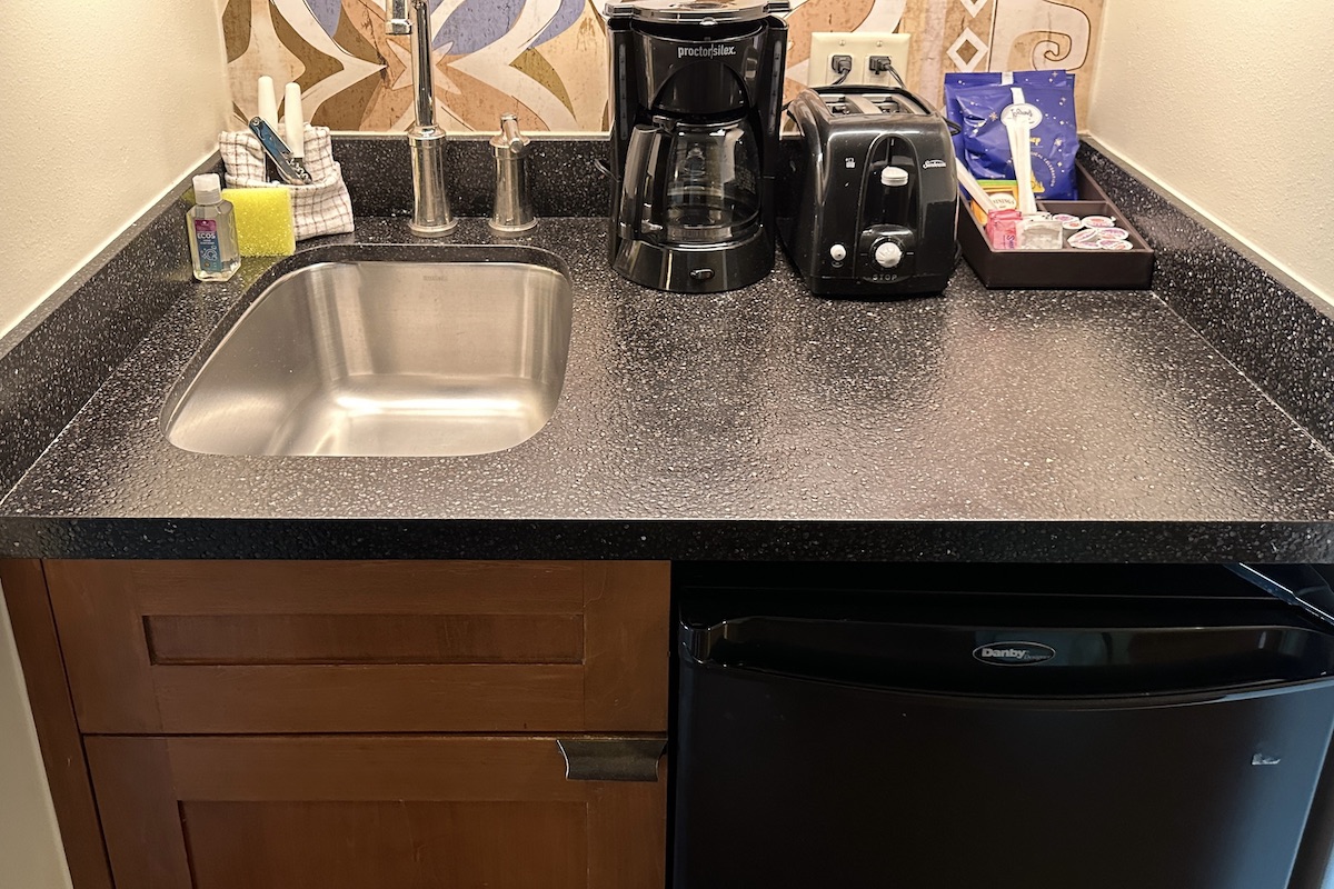 Kitchenette with bar sink, coffee maker and toaster