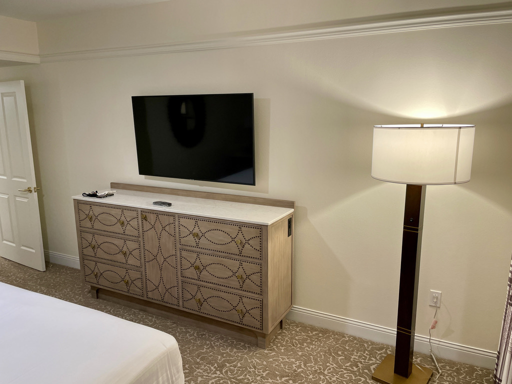 Master bedroom TV, dresser and floor lamp