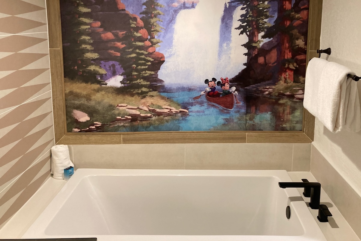 Master bathroom tub with artwork above