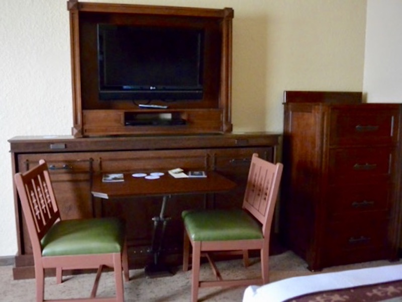 TV, convertible table with chairs and armoire (left)